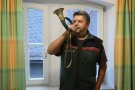 Mann mit Jagdhorn